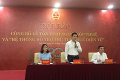 Họp báo công bố Lễ Tôn vinh Người nộp thuế và Hệ thống hỗ trợ thủ tục thuế điện tử, ngày 2/10. (Ảnh: Vietnam+)
