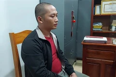 Đối tượng Trần Thanh Tú tại cơ quan điều tra. (Ảnh: TTXVN phát)