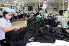 Sản xuất hàng may mặc xuất khẩu. (Ảnh: Trần Lê Lâm/TTXVN)