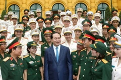 Chủ tịch nước Trần Đại Quang với các đại biểu tại buổi gặp mặt. (Ảnh: Nhan Sáng/TTXVN)