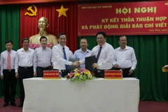 Quang cảnh lễ ký kết. (Ảnh: Ngọc Thiện/TTXVN)