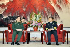 Thượng tướng Nguyễn Trọng Nghĩa chào xã giao Thượng tướng Miêu Hoa, Chủ nhiệm Bộ Công tác chính trị Quân ủy Trung ương Trung Quốc, ngày 3/12/2018, tại thủ đô Bắc Kinh. (Ảnh: Vĩnh Hà/TTXVN)