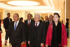 Tổng Bí thư, Chủ tịch nước Nguyễn Phú Trọng; Thủ tướng Chính phủ Nguyễn Xuân Phúc; Chủ tịch Quốc hội Nguyễn Thị Kim Ngân đến dự hội nghị. (Ảnh: Trí Dũng/TTXVN)