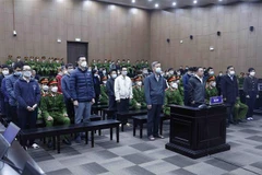 Các bị cáo tại phiên tòa sáng 21/12. (Ảnh: An Đăng/TTXVN)