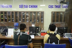 Một điểm thu ngân sách nhà nước tại tỉnh Yên Bái. (Ảnh: Tiến Khánh/TTXVN)