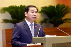 Chủ nhiệm Ủy ban Tài chính, Ngân sách của Quốc hội Lê Quang Mạnh trình bày Báo cáo thẩm tra dự án Luật Đầu tư công (sửa đổi). (Ảnh: Doãn Tấn/TTXVN)