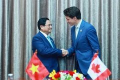 Thủ tướng Phạm Minh Chính gặp Thủ tướng Canada Justin Trudeau. (Ảnh: Dương Giang/TTXVN)