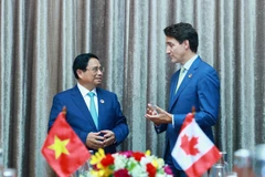 Thủ tướng Phạm Minh Chính gặp Thủ tướng Canada Justin Trudeau. (Ảnh: Dương Giang/TTXVN)