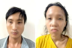 Nguyễn Quốc Toàn và Lê Thụy Thanh Tâm tại cơ quan công an. (Ảnh: TTXVN phát)