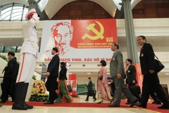 Các đại biểu đến dự Đại hội chiều 29/1. (Ảnh: TTXVN)