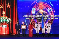 Tại Lễ Kỷ niệm 15 năm thành lập, PV Power vinh dự được Chủ tịch nước trao tặng Huân chương lao động hạng Nhì. (Ảnh: Xuân Quảng/Vietnam+)