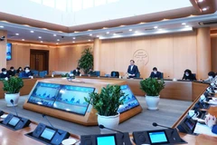 Cuộc họp của Ban Chỉ đạo phòng, chống dịch COVID-19 thành phố Hà Nội với các quận, huyện. (Ảnh: PV/Vietnam+)