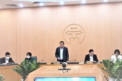 Phó Bí thư Thành ủy Hà Nội Nguyễn Văn Phong phát biểu tại cuộc họp của Ban Chỉ đạo phòng, chống dịch COVID-19 thành phố với các quận, huyện. (Ảnh: PV/Vietnam+)