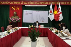 Các đại biểu phía Việt Nam tham dự hội nghị. (Nguồn: qdnd.vn)