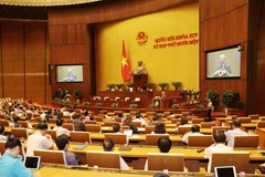 Chủ tịch nước Nguyễn Phú Trọng trình Quốc hội miễn nhiệm chức vụ Thủ tướng Chính phủ đối với ông Nguyễn Xuân Phúc. (Ảnh: Trí Dũng/TTXVN)