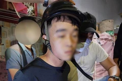 Nghi phạm Lê Phú Cao khi bị bắt giữ. (Ảnh: TTXVN phát)