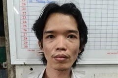 Đối tượng Nguyễn Hoàng Suốt tại cơ quan điều tra. (Ảnh: TTXVN phát)