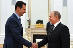 Tổng thống Nga Vladimir Putin và Tổng thống Syria Bashar al-Assad tại cuộc gặp ở Moskva. (Ảnh: AFP/TTXVN)