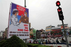 Tranh cổ động tấm lớn về phòng chống COVID-19. (Ảnh minh họa: Thanh Tùng/TTXVN)