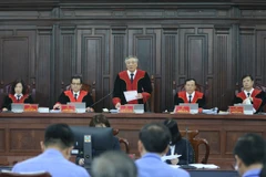 Chánh án Tòa án Nhân dân Tối cao Nguyễn Hòa Bình, Chủ tọa phiên tòa. (Ảnh: Doãn Tấn/TTXVN)