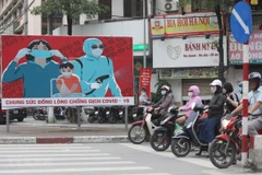 Tuyên truyền phòng chống COVID-19. (Nguồn: TTXVN)