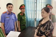 Đối tượng Trần Thị Cảnh tại cơ quan công an. (Ảnh: Võ Dung/TTXVN)