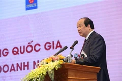 Bộ trưởng, Chủ nhiệm Văn phòng Chính phủ Mai Tiến Dũng, Chủ tịch Hội đồng tư vấn cải cách thủ tục hành chính của Thủ tướng Chính phủ phát biểu khai mạc hội nghị. (Ảnh: Dương Giang/TTXVN)