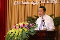 Chủ tịch Hội đồng Nhân dân tỉnh Bắc Ninh Nguyễn Quốc Chung phát biểu tại kỳ họp. (Ảnh: Thanh Thương/TTXVN)