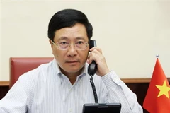 Phó Thủ tướng, Bộ trưởng Bộ Ngoại giao Phạm Bình Minh điện đàm với Ngoại trưởng Mỹ Mike Pompeo. (Ảnh: Lâm Khánh/TTXVN)