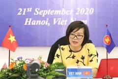 Bà Hà Thị Minh Đức – Phó Vụ trưởng Vụ Hợp tác quốc tế (Bộ Lao động-Thương binh và Xã hội) phát biểu tại diễn đàn. (Ảnh: Thanh Tùng/TTXVN)