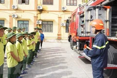 Hướng dẫn các kỹ năng phòng chống cháy nổ cơ bản cho các em nhỏ. (Ảnh minh họa. Nguồn: TTXVN)