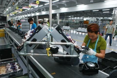 Dây chuyền sản xuất thiết bị điện tử gia dụng tại công ty LG Electronics Việt Nam. (Ảnh: Lâm Khánh/TTXVN)