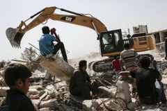 Cảnh đổ nát tại Kobane, miền bắc Syria sau các cuộc giao tranh với lực lượng PKK. (Nguồn: AFP/TTXVN)