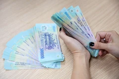 Cả đài diện người lao động và người sử dụng lao động đều đồng ý cần phải tăng lương tối thiểu vùng năm 2024. (Ảnh: PV/Vietnam+)