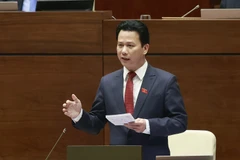 Bộ trưởng Bộ Tài nguyên và Môi trường Đặng Quốc Khánh giải trình, làm rõ một số vấn đề đại biểu Quốc hội nêu. (Ảnh: Doãn Tấn/TTXVN)