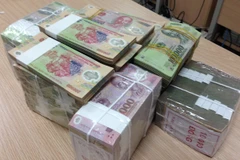 Nhiều ngân hàng công bố lợi nhuận ở mức cao. (Ảnh: Vietnam+)