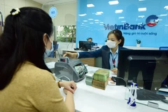 Giao dịch tại VietinBank. (Ảnh: Vietnam+)