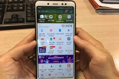 Mobile Money đã đáp ứng nhu cầu thiết thực của người dân. (Ảnh: Vietnam+)