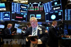 Giao dịch viên tại Sàn giao dịch chứng khoán New York, Mỹ. (Ảnh: AFP/TTXVN)