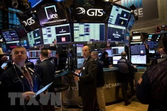 Giao dịch viên tại Sàn giao dịch chứng khoán New York, Mỹ. (Ảnh: THX/TTXVN)