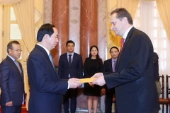 Chủ tịch nước Trần Đại Quang tiếp Đại sứ Cộng hòa Latvia, Ngài Maris Selga đến trình Quốc thư nhân nhiệm kỳ công tác tại Việt Nam. (Ảnh: Nhan Sáng/TTXVN)