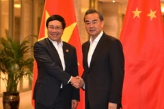 Phó Thủ tướng, Bộ trưởng Ngoại giao Phạm Bình Minh hội kiến với Bộ trưởng Ngoại giao Trung Quốc Vương Nghị. (Ảnh: Hải Yến/TTXVN)