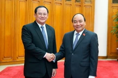 Thủ tướng Nguyễn Xuân Phúc tiếp Phó Thủ tướng Lào Sonsay Siphandone. (Ảnh: Thống Nhất/TTXVN)