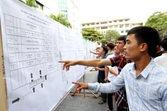 Lao động tham gia kỳ thi tiếng Hàn Quốc để sang nước này làm việc. (Ảnh minh họa: PVVietnam+)