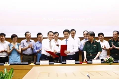 Quang cảnh lễ ký kết. (Ảnh: An Đăng/TTXVN)