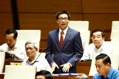 Phó Thủ tướng Chính phủ Vũ Đức Đam trả lời những chất vấn thuộc trách nhiệm chung của Chính phủ. (Ảnh: An Đăng/TTXVN)