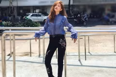 Ca sỹ Sĩ Thanh với tỏa sáng trên sàn diễn đường phố nhờ quần skinny thêu, sơmi vải sheer và boots. Ảnh minh họa. (Nguồn: Đẹp/Vietnam+)