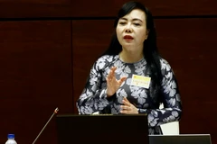 Bộ trưởng Bộ Y tế Nguyễn Thị Kim Tiến trả lời chất vấn của các đại biểu Quốc hội. (Ảnh: An Đăng/TTXVN)