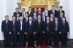 Đoàn đại biểu cấp cao Hội đồng Lý luận Trung ương Đảng Cộng sản Việt Nam và Hội đồng Khoa học Xã hội Quốc gia Lào. (Ảnh: Phương Hoa/TTXVN)