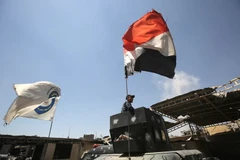 Các lực lượng Iraq tiến vào giải phóng thành cổ Mosul khỏi IS ngày 24/6. (Nguồn: AFP/TTXVN)